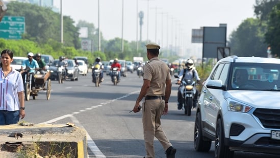 Police investigating the spot where a black Mahindra Thar collided with a divider on the Delhi-Gurugram Expressway in Gurugram. (Photo by Parveen Kumar/Hindustan Times)