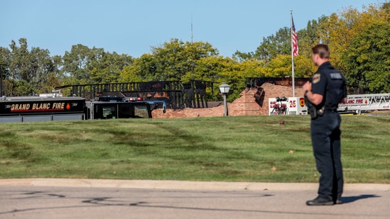 An emergency service official overlooks the debris of the attacked church in Grand Blanc, Michigan on Sunday.(Bill Pugliano/AFP)