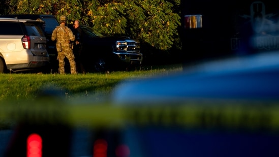 Michigan State Police and Michigan State Bomb Squad work outside a shooting suspect's residence on September 28, 2025 in Burton, Michigan.&nbsp;(Getty Images via AFP)