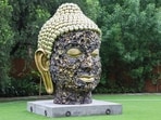 The “Buddha Head” dominates Shalini Passi’s garden.