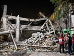 Rescue personnel inspect the site after a building collapsed at an Islamic boarding school in Sidoarjo, East Java province on September 29, 2025. Rescue personnel inspect the site after a building collapsed at an Islamic boarding school in Sidoarjo, East Java province on September 29, 2025.