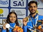 Isha Taksale and Himanshu pose with their 10m air rifle mixed team gold medals at the ISSF Junior World Cup in Delhi on Tuesday. (NRAI)