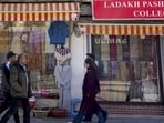 People walk past shops at a market during a four-hour relaxation in the curfew in Leh on Tuesday. (PTI Photo) People walk past shops at a market during a four-hour relaxation in the curfew in Leh on Tuesday. (PTI Photo)