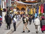 Security personnel keeping a watch at a market during the four-hour relaxation in the curfew in Leh on Tuesday. (PTI Photo) Security personnel keeping a watch at a market during the four-hour relaxation in the curfew in Leh on Tuesday. (PTI Photo)