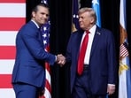 President Donald Trump shakes hands with Defense Secretary Pete Hegseth during a meeting of senior military leaders at Marine Corps Base Quantico in 