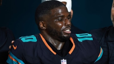 Tyreek Hill of the Miami Dolphins leaves the field following an injury during the third quarter against the New York Jets. (Getty Images via AFP) Tyreek Hill of the Miami Dolphins leaves the field following an injury during the third quarter against the New York Jets. (Getty Images via AFP)