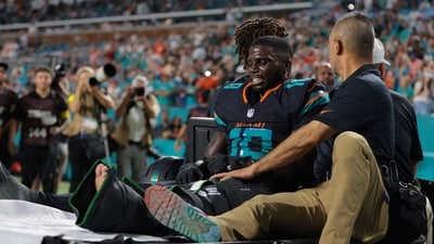 Miami Dolphins wide receiver Tyreek Hill (10) reacts after being placed on a medical cart. (IMAGN IMAGES via Reuters Connect)