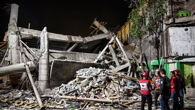 Rescue personnel inspect the site after a building collapsed at an Islamic boarding school in Sidoarjo, East Java province on September 29, 2025. (AFP) Rescue personnel inspect the site after a building collapsed at an Islamic boarding school in Sidoarjo, East Java province on September 29, 2025. (AFP)