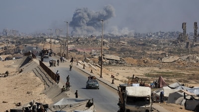 Smoke rises during an Israeli military operation as displaced Palestinians flee Gaza City, in the central Gaza Strip, on September 30, 2025. (Dawoud Abu Alkas/Reuters)