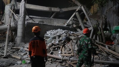 Rescuers search for survivors after a building collapsed at an Islamic boarding school, in Sidoarjo, East Java, Indonesia, Monday, Sept. 29, 2025. (AP Photo/Trisnadi) (AP) Rescuers search for survivors after a building collapsed at an Islamic boarding school, in Sidoarjo, East Java, Indonesia, Monday, Sept. 29, 2025. (AP Photo/Trisnadi) (AP)