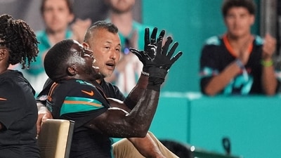 Miami Dolphins wide receiver Tyreek Hill, right font, puts his arms up as he is carted off the field. (AP) Miami Dolphins wide receiver Tyreek Hill, right font, puts his arms up as he is carted off the field. (AP)