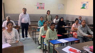 Learners appearing for an NILP exam in a government school in Ludhiana on Tuesday. (HT photo) Learners appearing for an NILP exam in a government school in Ludhiana on Tuesday. (HT photo)