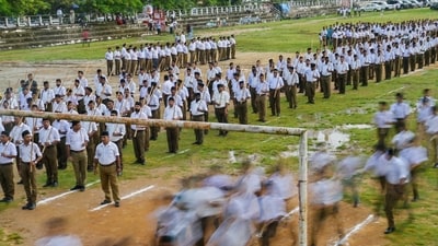 RSS volunteers take part in a rally on the occasion of 'Mahalaya' in Agartala, Sunday, Sept. 21 (PTI) RSS volunteers take part in a rally on the occasion of 'Mahalaya' in Agartala, Sunday, Sept. 21 (PTI)