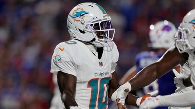 Tyreek Hill #10 of the Miami Dolphins celebrates after scoring a touchdown in the fourth quarter of the game against the Buffalo Bills (Getty Images via AFP) Tyreek Hill #10 of the Miami Dolphins celebrates after scoring a touchdown in the fourth quarter of the game against the Buffalo Bills (Getty Images via AFP)