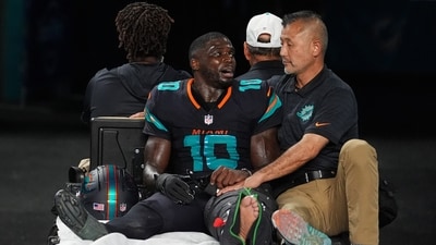 Miami Dolphins wide receiver Tyreek Hill (10) talks with a staff member as he is carted off the field after suffering an unknown lower leg injury (AP) Miami Dolphins wide receiver Tyreek Hill (10) talks with a staff member as he is carted off the field after suffering an unknown lower leg injury (AP)