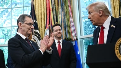 Pfizer CEO Albert Bourla (L) applauds as US President Donald Trump makes an announcement on prescription drugs in the Oval Office of the White House in Washington, DC, on September 30, 2025. (Photo by Brendan SMIALOWSKI / AFP) (AFP)