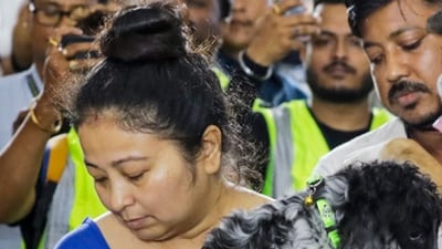 Zubeen Garg's wife Garima Saikia Garg carries their pets to the tribute programme dedicated to him in Guwahati. (PTI) Zubeen Garg's wife Garima Saikia Garg carries their pets to the tribute programme dedicated to him in Guwahati. (PTI)