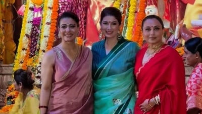 Kajol, Twinkle Khanna, and Rani Mukerji pose during Maha Ashtami celebrations at Durga Puja pandal. (Instagram) Kajol, Twinkle Khanna, and Rani Mukerji pose during Maha Ashtami celebrations at Durga Puja pandal. (Instagram)