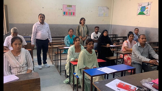 Learners appearing for an NILP exam in a government school in Ludhiana on Tuesday. (HT photo)