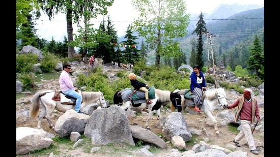 Tourist enjoying horse riding at Solang Valley in Manali on Tuesday. (Aqil Khan/HT)