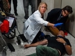 A photojournalist was hospitalized after being shoved to the ground by masked federal agents in NYC. A photojournalist was hospitalized after being shoved to the ground by masked federal agents in NYC.