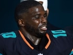 Tyreek Hill of the Miami Dolphins leaves the field following an injury during the third quarter against the New York Jets.