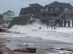 Waves from Hurricanes Humberto and Imelda destroy a home in Buxton, N.C., Tuesday, Sept. 30, 2025. (Heather Jennette via AP) Waves from Hurricanes Humberto and Imelda destroy a home in Buxton, N.C., Tuesday, Sept. 30, 2025. (Heather Jennette via AP)