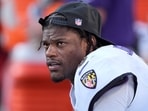 Baltimore Ravens quarterback Lamar Jackson sits on the bench after being replaced by Cooper Rush