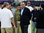 Pakistan's Minister of Interior Mohsin Naqvi, center, stands with officials on the field after India won the Asia Cup cricket final against Pakistan at Dubai International Cricket Stadium. Pakistan's Minister of Interior Mohsin Naqvi, center, stands with officials on the field after India won the Asia Cup cricket final against Pakistan at Dubai International Cricket Stadium.