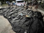 Bodies of victims lie covered outside the Cebu Provincial Hospital Bogo City after a strong earthquake struck in Bogo city, Cebu province, central Philippines on Wednesday, Oct. 1, 2025.