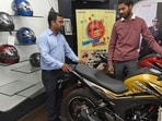 Pune, India - Dec. 7, 2018: Customers checking two wheelers at a bike showroom on JM road in Pune, India, on Friday, December 7, 2018. (Photo by Pratham Gokhale/Hindustan Times) (Pratham Gokhale/HT Photo) Pune, India - Dec. 7, 2018: Customers checking two wheelers at a bike showroom on JM road in Pune, India, on Friday, December 7, 2018. (Photo by Pratham Gokhale/Hindustan Times) (Pratham Gokhale/HT Photo)