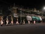 Security personnel patrol a deserted road after relaxation in curfew ended, in Leh on Wednesday. (PTI)