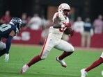 Arizona Cardinals running back Trey Benson, right, runs with the ball as Seattle Seahawks safety Julian Love defends Arizona Cardinals running back Trey Benson, right, runs with the ball as Seattle Seahawks safety Julian Love defends