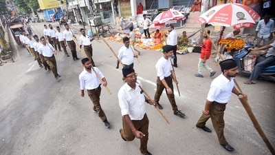 Patna: Volunteers of the Rashtriya Swayamsevak Sangh (RSS) take part in a Path Sanchalan (route march), the centenary year of RSS, ahead of the Vijayadashami festival, in Patna on Sunday. (ANI Photo) (Pappi sharma)