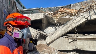At least six students are still alive beneath the rubble. (AP) At least six students are still alive beneath the rubble. (AP)