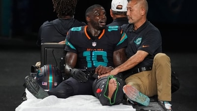 Miami Dolphins wide receiver Tyreek Hill (10) talks with a staff member as he is carted off the field. (AP) Miami Dolphins wide receiver Tyreek Hill (10) talks with a staff member as he is carted off the field. (AP)