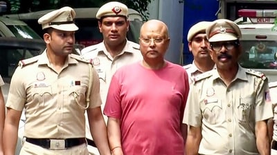 Delhi Police apprehended Chaitanyananda Saraswati from Agra. He is an accused in a case involving the molestation of female students molesting case. (ANI Video Grab) Delhi Police apprehended Chaitanyananda Saraswati from Agra. He is an accused in a case involving the molestation of female students molesting case. (ANI Video Grab)