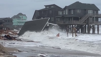 Waves from Hurricanes Humberto and Imelda destroy a home in Buxton, N.C., Tuesday, Sept. 30, 2025. (Heather Jennette via AP) (AP)