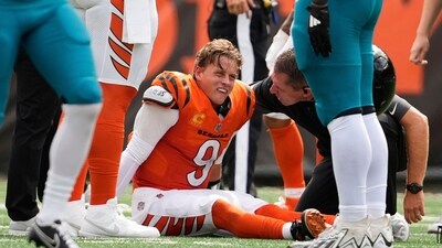 Cincinnati Bengals quarterback Joe Burrow (9) grimaces after being sacked by Jacksonville Jaguars defensive tackle Arik Armstead (91) during the first half of an NFL football game. (AP) Cincinnati Bengals quarterback Joe Burrow (9) grimaces after being sacked by Jacksonville Jaguars defensive tackle Arik Armstead (91) during the first half of an NFL football game. (AP)