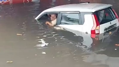 Scene just before UP cop saved two from the car in Mathura. (X/ UP police) Scene just before UP cop saved two from the car in Mathura. (X/ UP police)