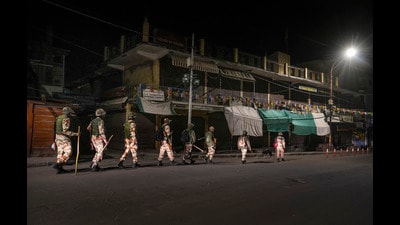 Security personnel patrol a deserted road after relaxation in curfew ended, in Leh on Wednesday. (PTI) Security personnel patrol a deserted road after relaxation in curfew ended, in Leh on Wednesday. (PTI)