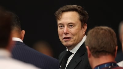 Tesla CEO Elon Musk attends the public memorial service for right-wing activist Charlie Kirk at State Farm Stadium in Glendale, Arizona, on September 21, 2025. (Photo by Patrick T. Fallon / AFP) (AFP) Tesla CEO Elon Musk attends the public memorial service for right-wing activist Charlie Kirk at State Farm Stadium in Glendale, Arizona, on September 21, 2025. (Photo by Patrick T. Fallon / AFP) (AFP)