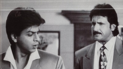 Shah Rukh Khan with Kiran Kumar in a still from the film. (IMDb) Shah Rukh Khan with Kiran Kumar in a still from the film. (IMDb)