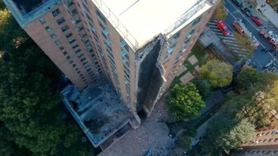 A part of a high-rise apartment building collapsed, leaving a corner of the building in a pile of rubble, in New York, on Wednesday. (AP)