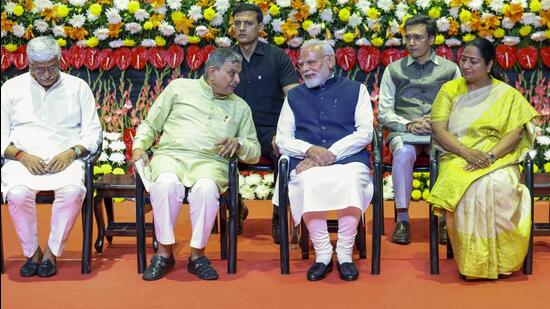 Prime Minister Narendra Modi, Union minister for culture Gajendra Singh Shekhawat, Delhi chief minister Rekha Gupta and RSS Sarkaryavah Dattatreya Hosabale during the centenary celebrations of the RSS, in New Delhi. (PMO via PTI)
