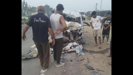 The mangled remains of the vehicle after it rammed into a truck parked on the roadside in Muzaffarnagar district on Wednesday. (HT Photo)