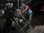 A worker at a cement factory. (AFP File Photo) A worker at a cement factory. (AFP File Photo)