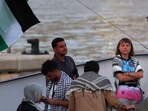 Swedish climate activist Greta Thunberg (R) is seen on board of a vessel of a civilian flotilla, carrying pro-Palestinian activists, and humanitarian aid.