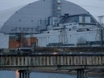 A general view shows the New Safe Confinement (NSC) structure over the old sarcophagus covering the damaged fourth reactor at the Chernobyl Nuclear Power Plant in Chernobyl.