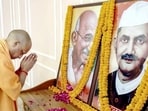 UP chief minister Yogi Adityanath pays homage to Mahatma Gandhi and former PM Lal Bahadur Shastri on the occasion of their birth anniversary, at Gorakhnath Temple in Gorakhpur on October 2. (Agency)